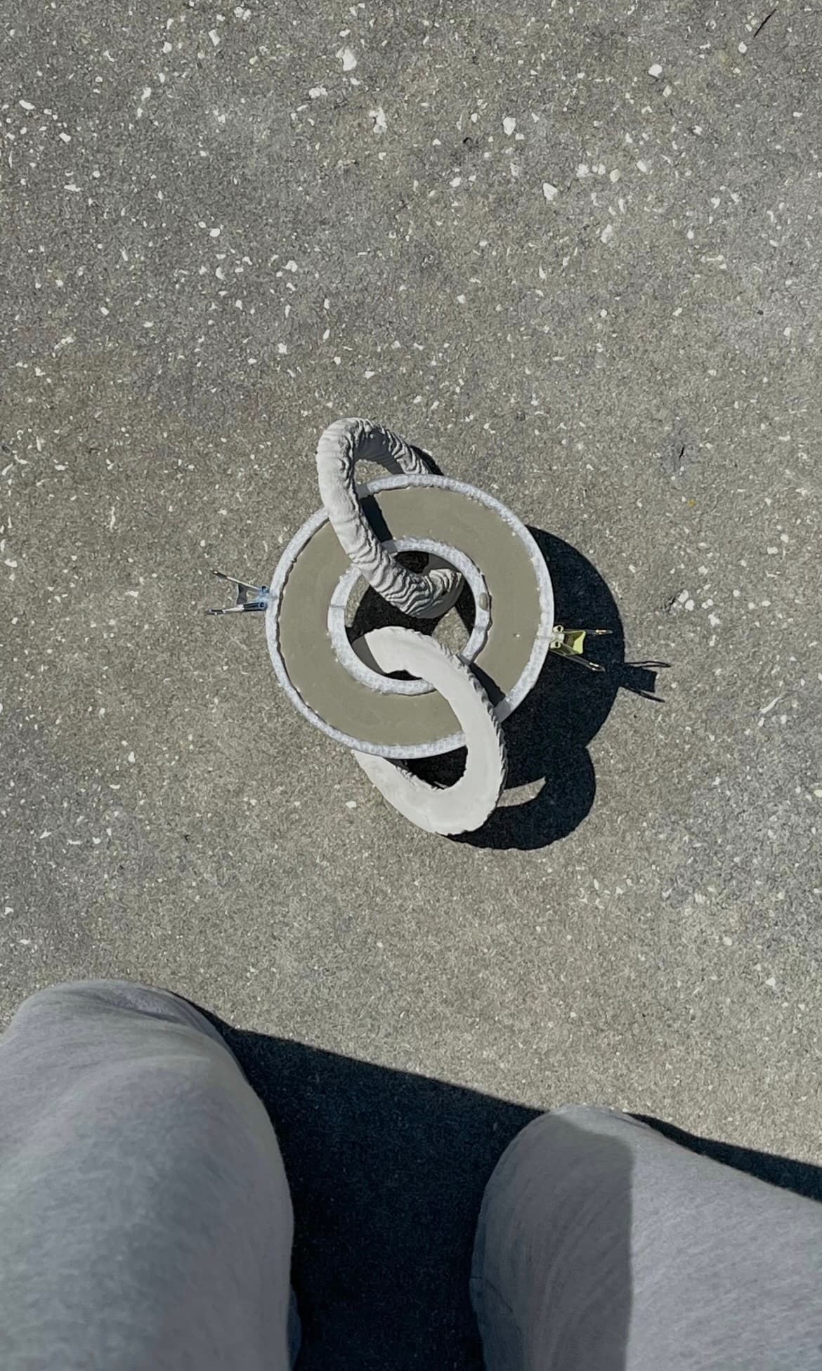 Interlocking cast rings on the studio floor